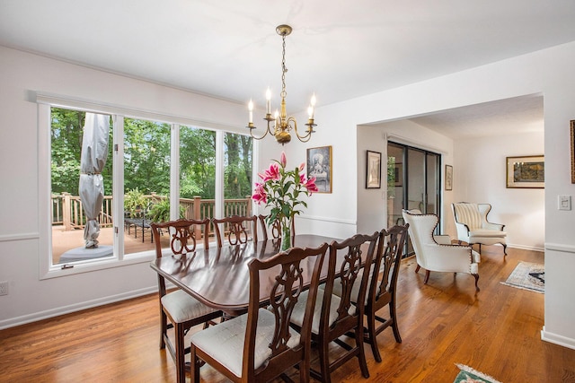 3924 Penberton Dr, Ann Arbor, MI 48105 - dining space featuring a chandelier, wood finished floors, and healthy amount of natural light