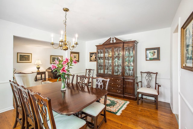 3924 Penberton Dr, Ann Arbor, MI 48105 - dining area featuring a chandelier and wood finished floors