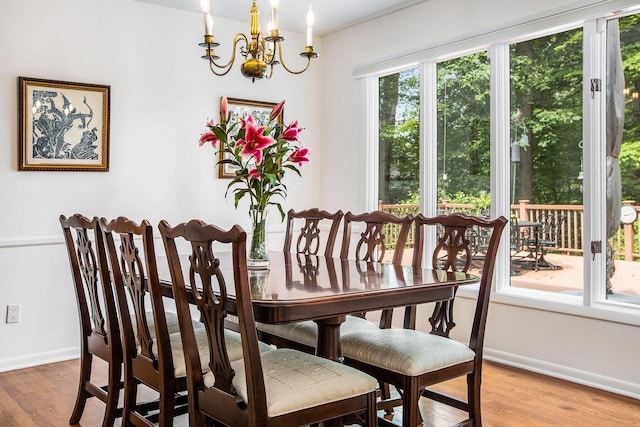 3924 Penberton Dr, Ann Arbor, MI 48105 - dining area featuring a chandelier and wood finished floors