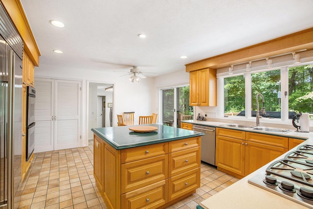 3924 Penberton Dr, Ann Arbor, MI 48105 - kitchen with appliances with stainless steel finishes, a center island, recessed lighting, a ceiling fan, and light tile patterned floors