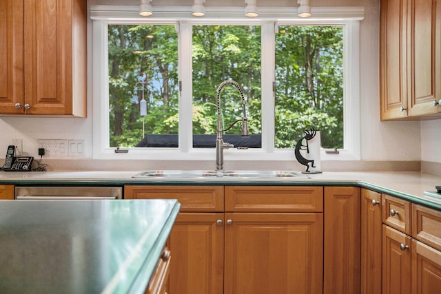 3924 Penberton Dr, Ann Arbor, MI 48105 - kitchen with plenty of natural light, light countertops, and brown cabinetry