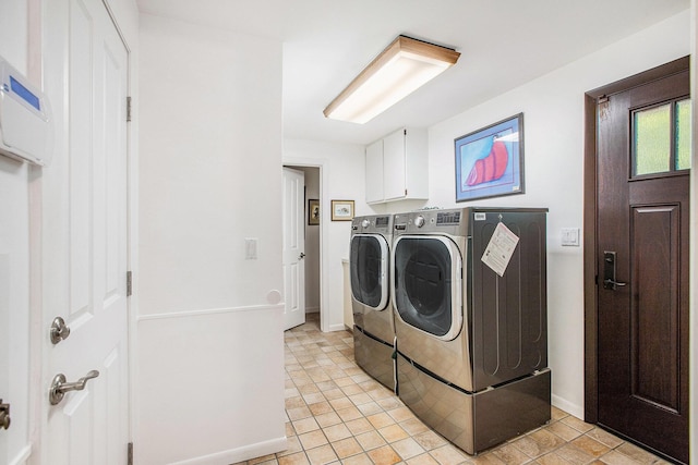 3924 Penberton Dr, Ann Arbor, MI 48105 - laundry room with washer and clothes dryer and cabinet space