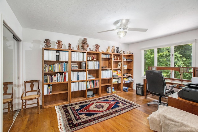 3924 Penberton Dr, Ann Arbor, MI 48105 - home office featuring wood finished floors, a ceiling fan, and a textured ceiling