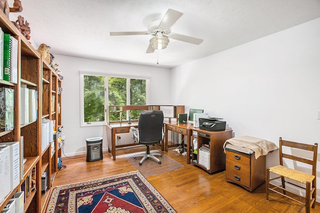 3924 Penberton Dr, Ann Arbor, MI 48105 - office featuring wood finished floors, ceiling fan, and a textured ceiling