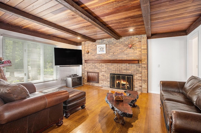 3924 Penberton Dr, Ann Arbor, MI 48105 - living area with a wood ceiling with exposed beams, a brick fireplace, and wood finished floors