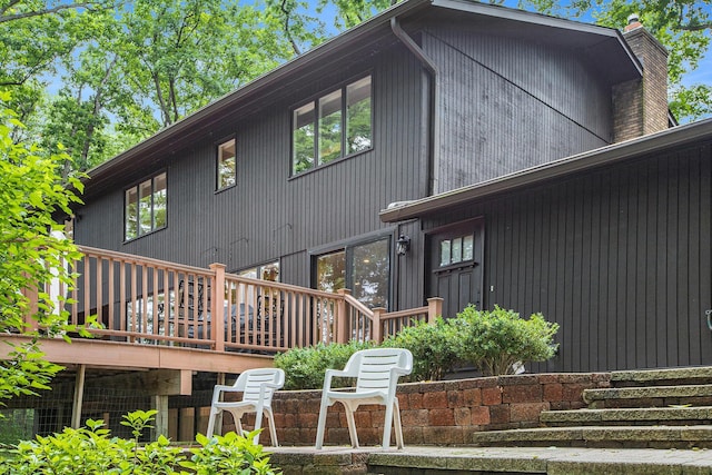 3924 Penberton Dr, Ann Arbor, MI 48105 - rear view of house featuring a chimney and a deck