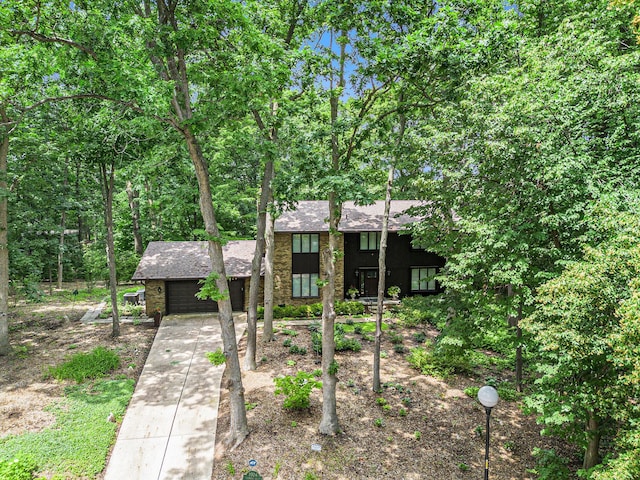 3924 Penberton Dr, Ann Arbor, MI 48105 - view of front of property featuring an attached garage, driveway, and roof with shingles