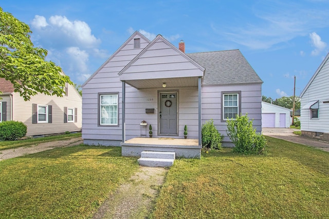 1209 Mohawk Ln, Saint Joseph, MI 49085 - bungalow-style home with a front yard, a chimney, a garage, and roof with shingles
