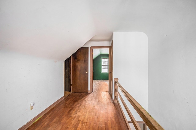 1209 Mohawk Ln, Saint Joseph, MI 49085 - bonus room with lofted ceiling and hardwood / wood-style floors