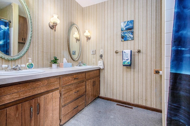 1209 Mohawk Ln, Saint Joseph, MI 49085 - full bath with wallpapered walls and double vanity