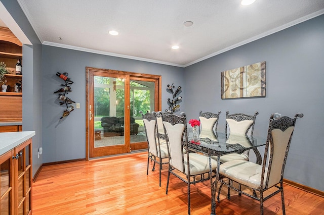 4102 Tomahawk Way, Saint Joseph, MI 49085 - dining area featuring crown molding, light wood-style floors, and recessed lighting