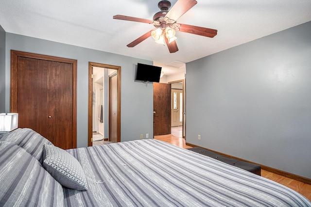 4102 Tomahawk Way, Saint Joseph, MI 49085 - bedroom with a closet, ceiling fan, and light wood finished floors