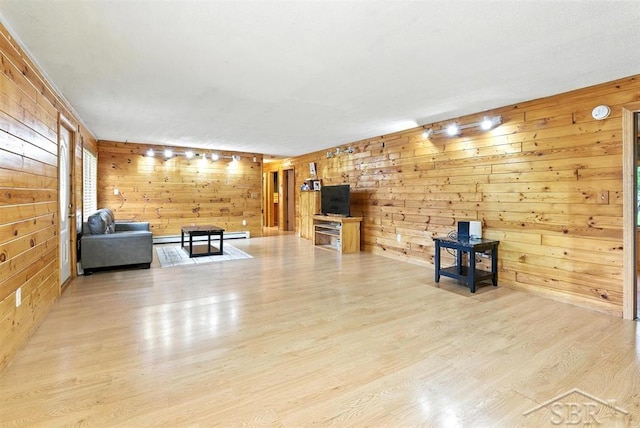 534 S Main St, Au Gres, MI 48703 - living room with wooden walls and wood finished floors