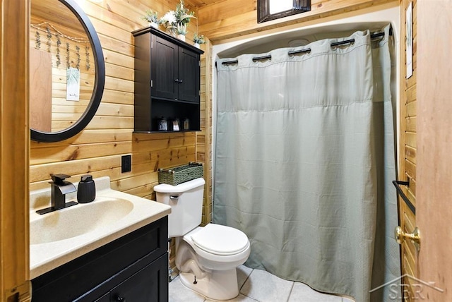 534 S Main St, Au Gres, MI 48703 - bathroom featuring wooden walls, tile patterned flooring, and vanity