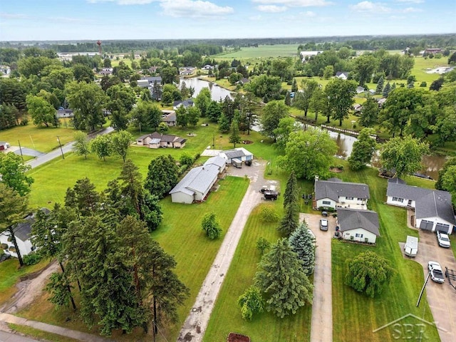 534 S Main St, Au Gres, MI 48703 - aerial perspective of suburban area featuring a nearby body of water