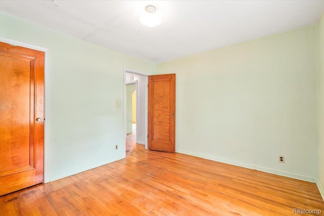 35432 Currier St, Wayne, MI 48184 - unfurnished bedroom featuring light wood-style floors and baseboards