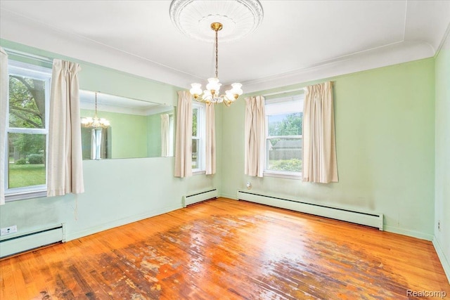 35432 Currier St, Wayne, MI 48184 - empty room with a chandelier, a baseboard radiator, healthy amount of natural light, and crown molding
