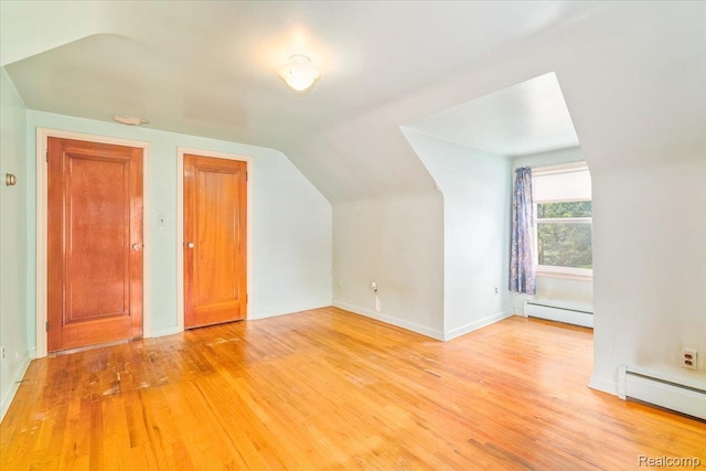 35432 Currier St, Wayne, MI 48184 - additional living space with a baseboard heating unit, lofted ceiling, and light wood-style flooring