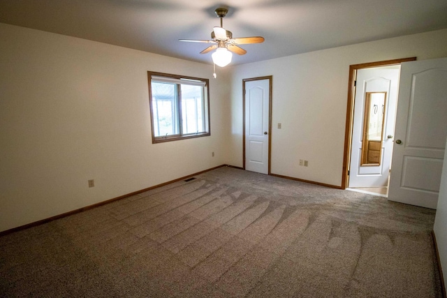 5546 Hickory Cir, Flushing, MI 48433 - carpeted spare room with baseboards and a ceiling fan