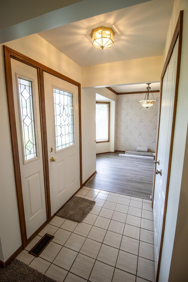 5546 Hickory Cir, Flushing, MI 48433 - entrance foyer with light tile patterned flooring and wallpapered walls