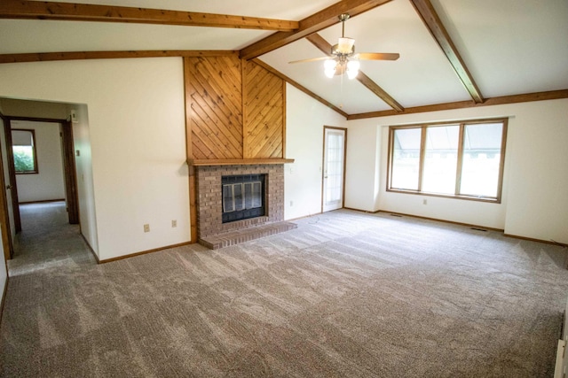 5546 Hickory Cir, Flushing, MI 48433 - unfurnished living room featuring light carpet, a ceiling fan, a fireplace, and wooden walls