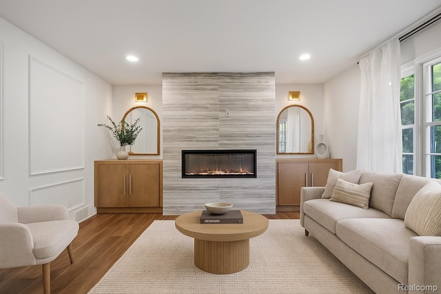 3025 Clawson Ave, Royal Oak, MI 48073 - living area with a fireplace, recessed lighting, and wood finished floors