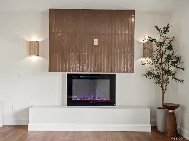 3025 Clawson Ave, Royal Oak, MI 48073 - detailed view of a glass covered fireplace and wood finished floors