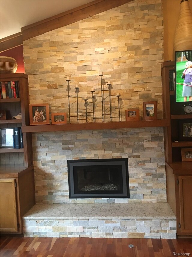 472 Ashton Ct SE, Grand Rapids, MI 49546 - detailed view of wood finished floors and a stone fireplace
