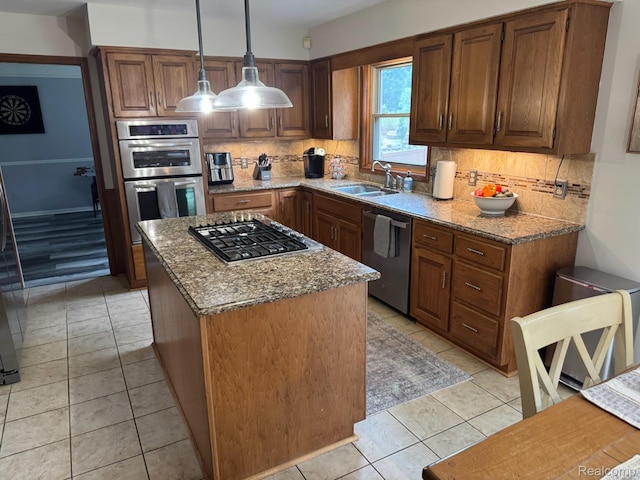 472 Ashton Ct SE, Grand Rapids, MI 49546 - kitchen featuring appliances with stainless steel finishes, backsplash, light stone countertops, and a center island