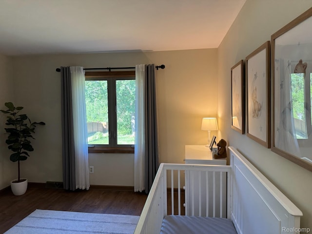 472 Ashton Ct SE, Grand Rapids, MI 49546 - bedroom featuring wood finished floors and multiple windows