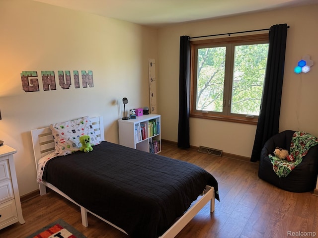 472 Ashton Ct SE, Grand Rapids, MI 49546 - bedroom featuring wood finished floors and baseboards