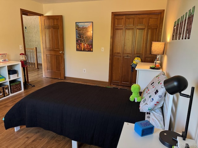 472 Ashton Ct SE, Grand Rapids, MI 49546 - bedroom featuring wood finished floors and baseboards