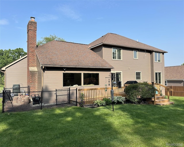 472 Ashton Ct SE, Grand Rapids, MI 49546 - back of property featuring a chimney and roof with shingles