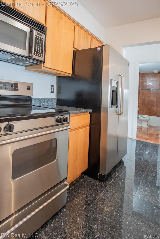 3559 Port Cove Dr Unit 25, Waterford, MI 48328 - kitchen with stainless steel appliances, granite tiled floors, and light brown cabinets