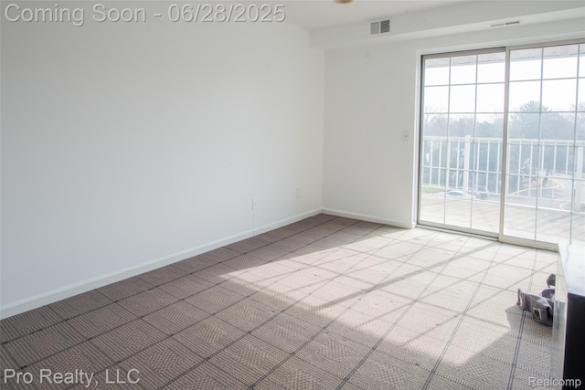 3559 Port Cove Dr Unit 25, Waterford, MI 48328 - spare room featuring light colored carpet and baseboards