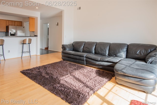 3559 Port Cove Dr Unit 25, Waterford, MI 48328 - living area with wood finished floors
