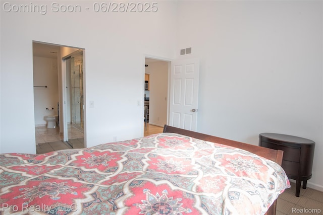 3559 Port Cove Dr Unit 25, Waterford, MI 48328 - bedroom featuring a high ceiling and connected bathroom