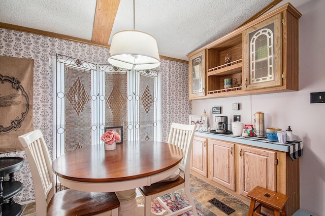 1950 S 13th, Niles, MI 49120 - dining room featuring wallpapered walls, a textured ceiling, and crown molding
