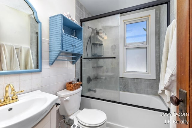 1802 Cherry St, Dorr, MI 49323 - bathroom with tile walls, vanity, enclosed tub / shower combo, and backsplash