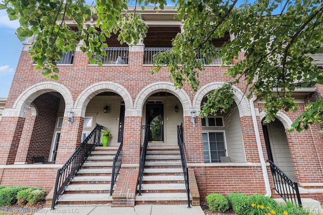3994 Forester Blvd, Auburn Hills, MI 48326 - townhome / multi-family property with brick siding, stairs, and a porch