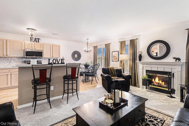 3994 Forester Blvd, Auburn Hills, MI 48326 - living area with a chandelier, light carpet, ornamental molding, and a tile fireplace