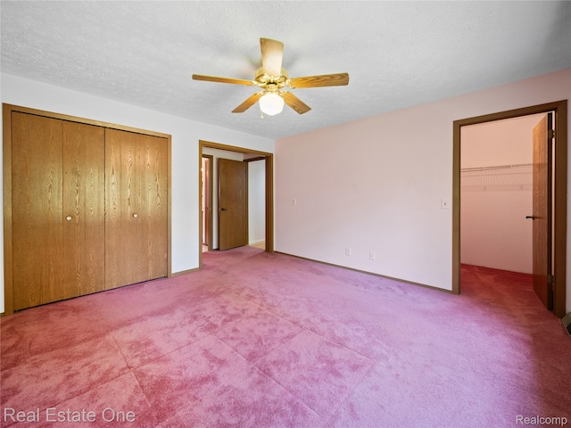 3225 W Marr Rd, Howell, MI 48855 - unfurnished bedroom featuring carpet flooring, a closet, and a ceiling fan