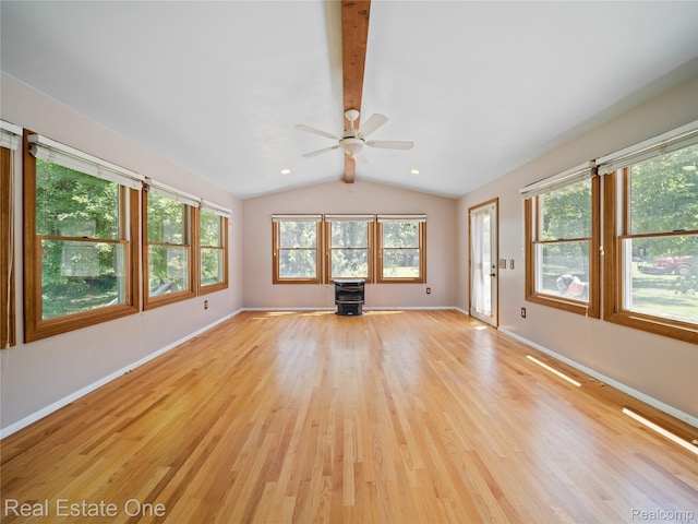 3225 W Marr Rd, Howell, MI 48855 - unfurnished living room featuring light wood-type flooring, a wood stove, and a ceiling fan