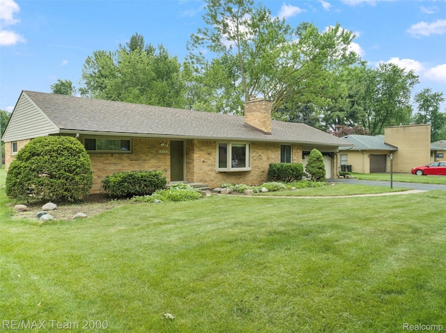 30695 Lyndon St, Livonia, MI 48154 - ranch-style house featuring an attached garage, a chimney, a front yard, brick siding, and a shingled roof