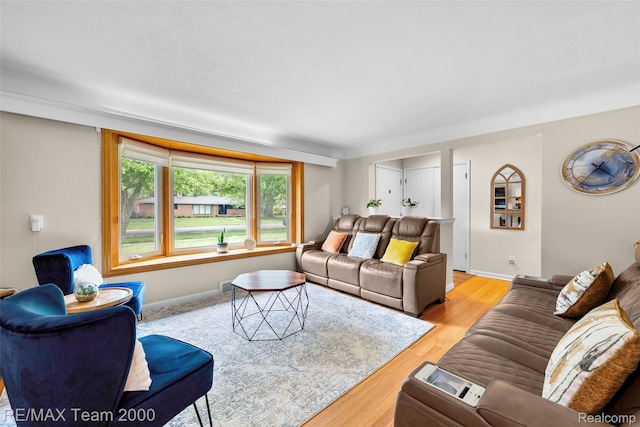 30695 Lyndon St, Livonia, MI 48154 - living room featuring light wood-style floors and baseboards