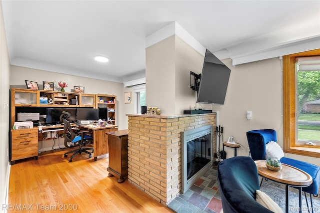 30695 Lyndon St, Livonia, MI 48154 - office space with healthy amount of natural light, a brick fireplace, and light wood finished floors