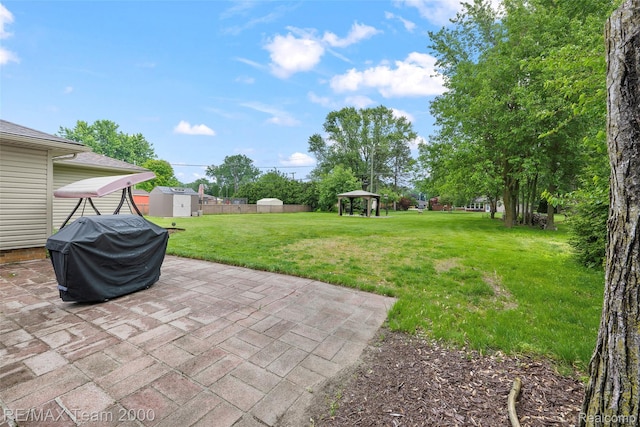 30695 Lyndon St, Livonia, MI 48154 - view of green lawn featuring a storage shed, a gazebo, and a patio area