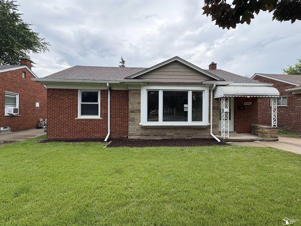 9309 Allen Rd, Allen Park, MI 48101 - back of house featuring cooling unit, a lawn, a shingled roof, a chimney, and stone siding