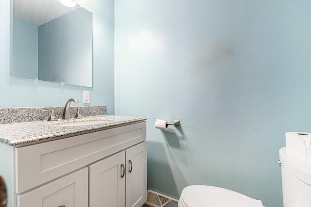 356 Riverview Dr, Plainwell, MI 49080 - half bathroom featuring toilet and vanity