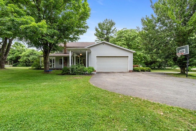 9719 King Rd, Spring Arbor, MI 49283 - view of front of home featuring a front lawn, driveway, and a garage